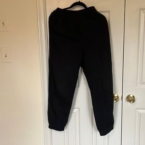 Black jogger jeans with crisscross patterns